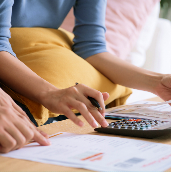 Patient calculating treatment costs with calculator